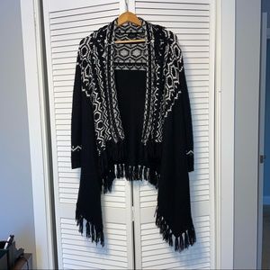 Press black and white sweater